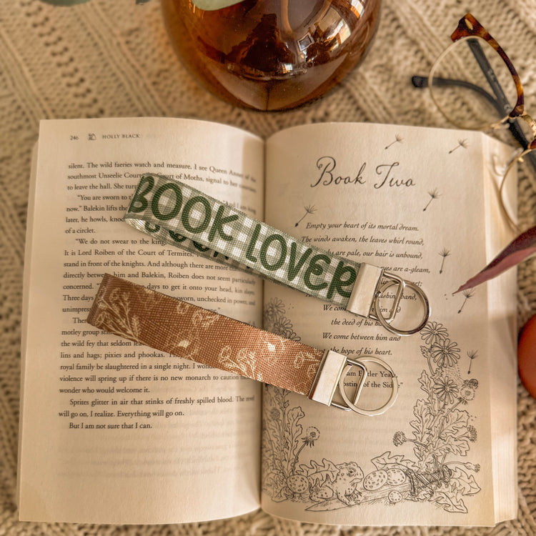 2 key fobs laid on on a page in a book