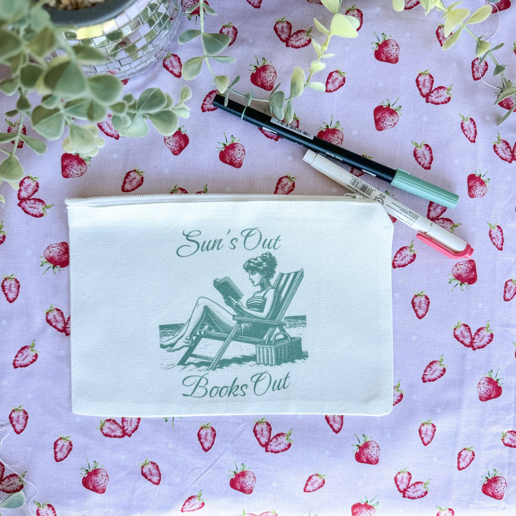 White canvas pouch with Suns Out Books Out text and retro summer reading illustration