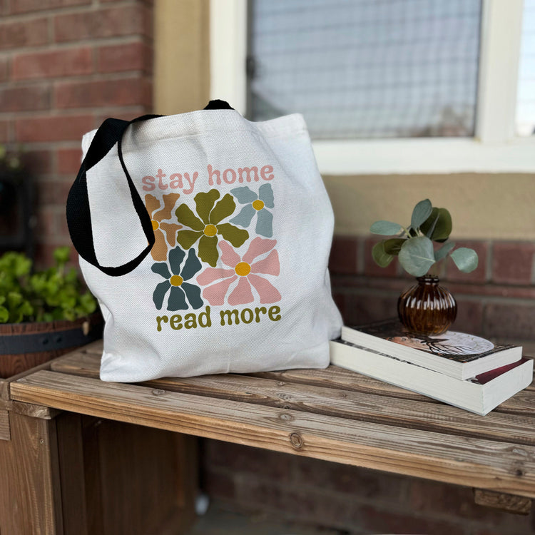 Canvas tote bag with Stay Home Read More text and retro floral design