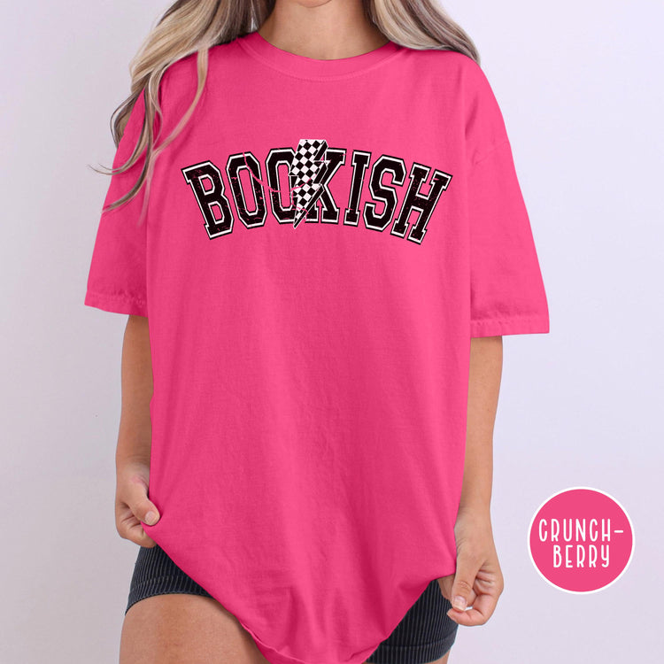 Oversized Bookish Bolt tee in orchid, styled with books and cozy reading props.