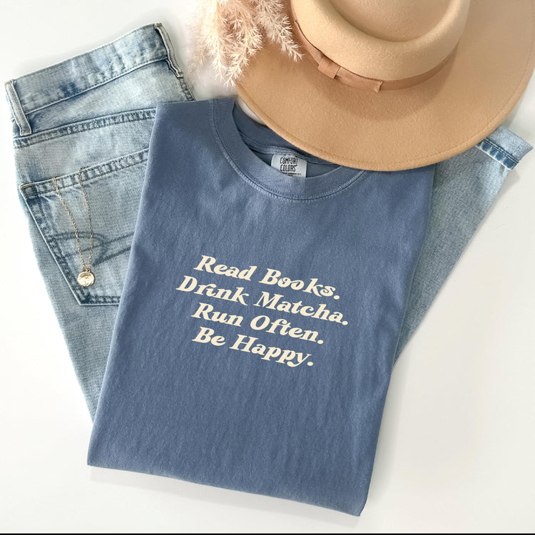 A blue t-shirt with the text 'Read Books. Drink Matcha.