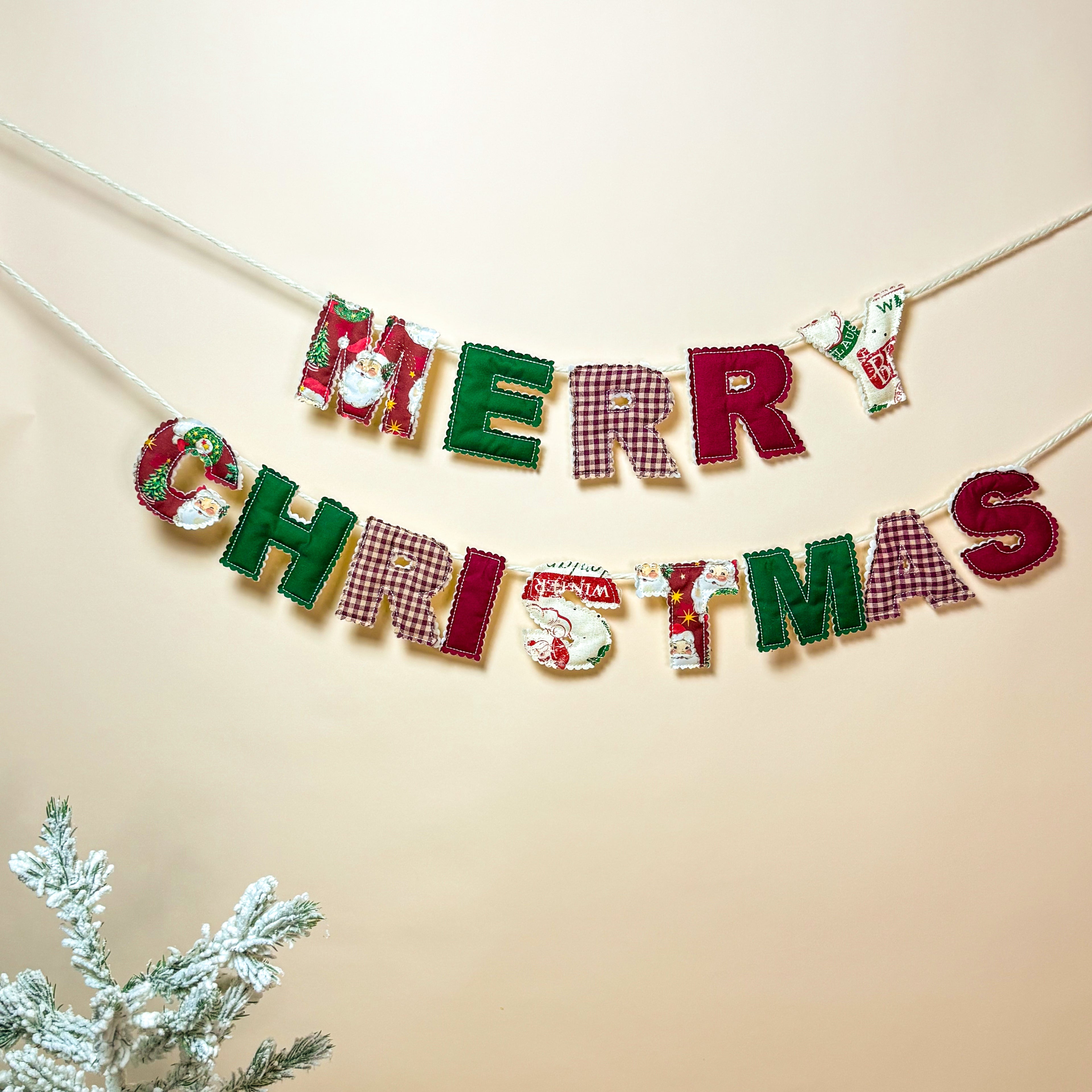 Full view of the Merry Christmas garland with warm holiday decorations.