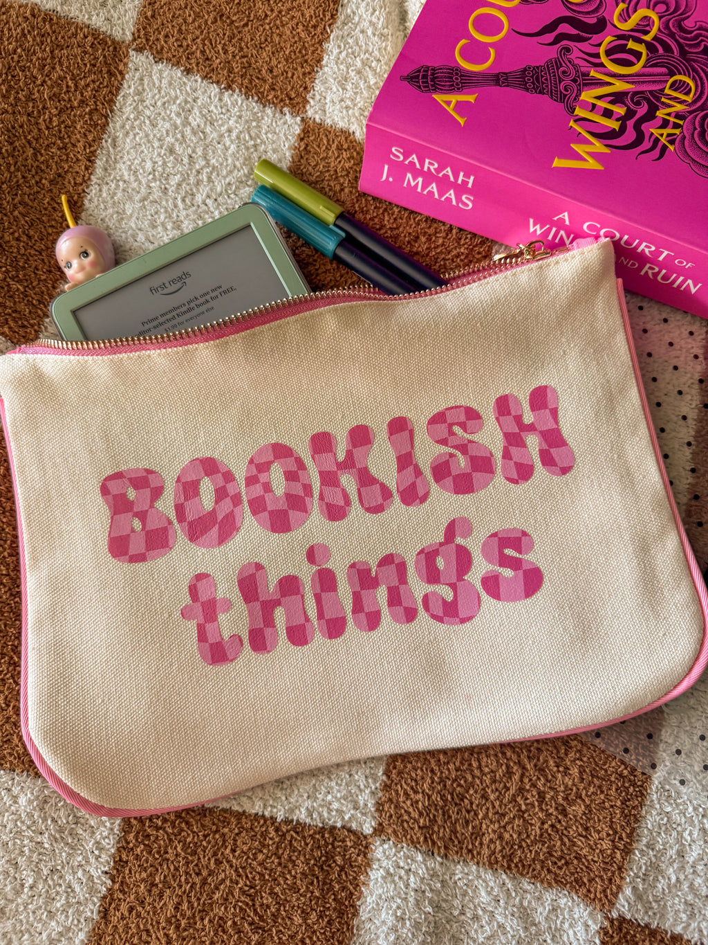 Bookish Things pouch styled with markers and cozy reading setup