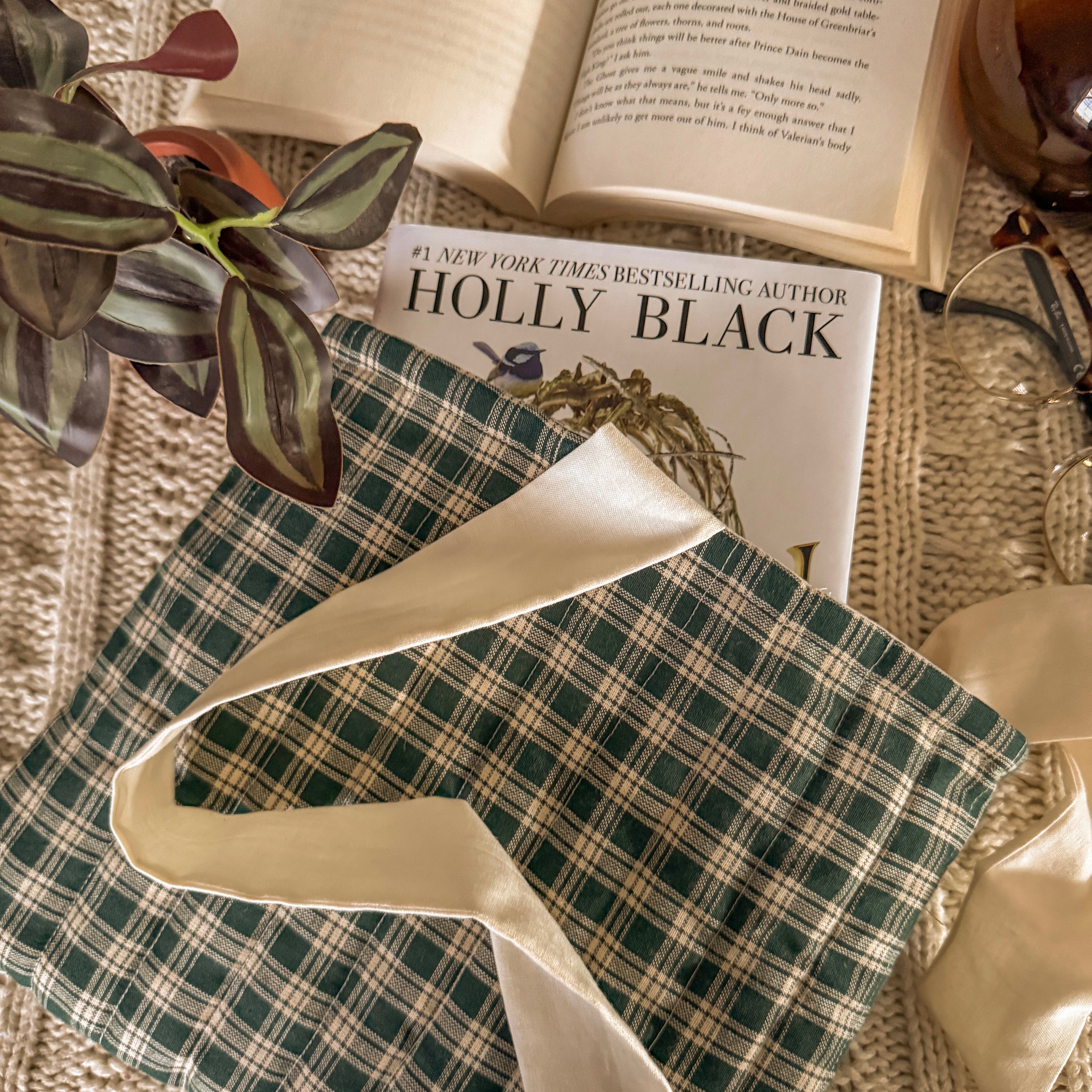 Green gingham book sleeve protecting hardcover book 