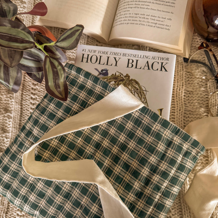 Green gingham book sleeve protecting hardcover book 