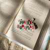 Colorful 'Merry Bokmas' sticker on an open book