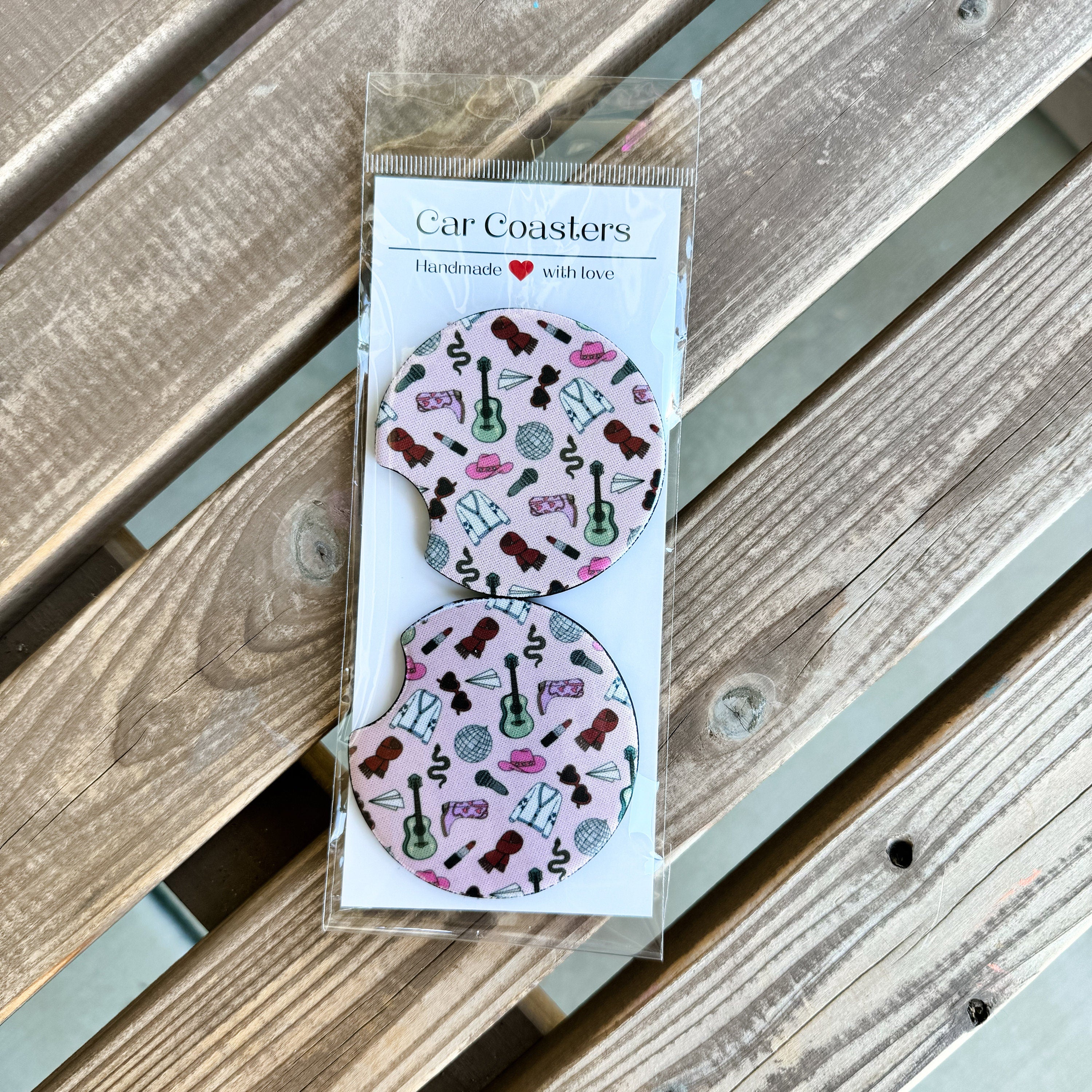 Close-up of music-era coasters styled in a plant pot