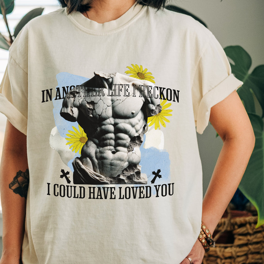 A model wearing bookish tee with subtle literary design and cozy styling.