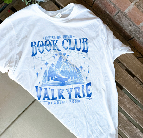 Close-up of book club tee showing vibrant sublimated graphic and soft polyester texture.