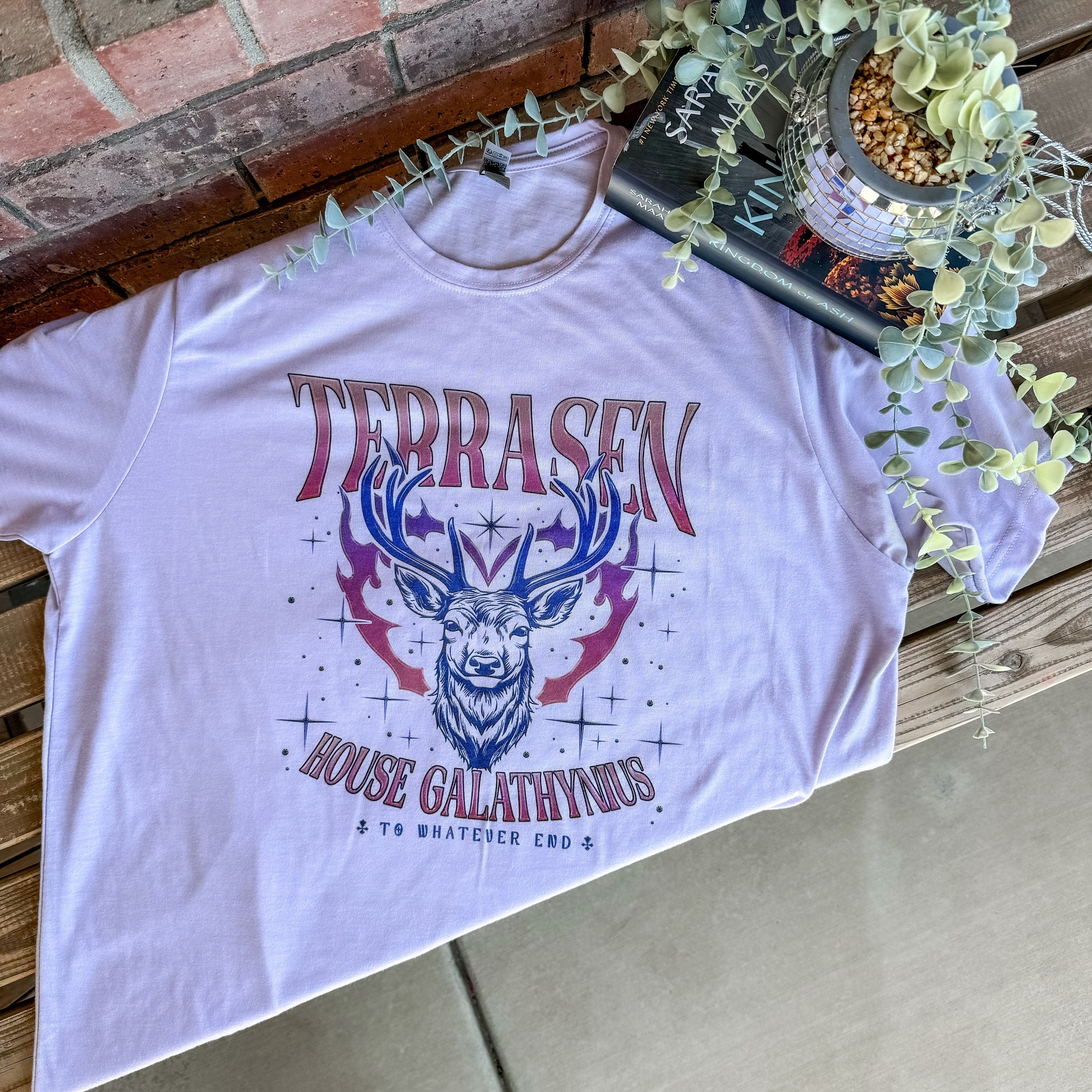 Flat lay of unisex bookish tee with vintage distressed look and cozy styling.