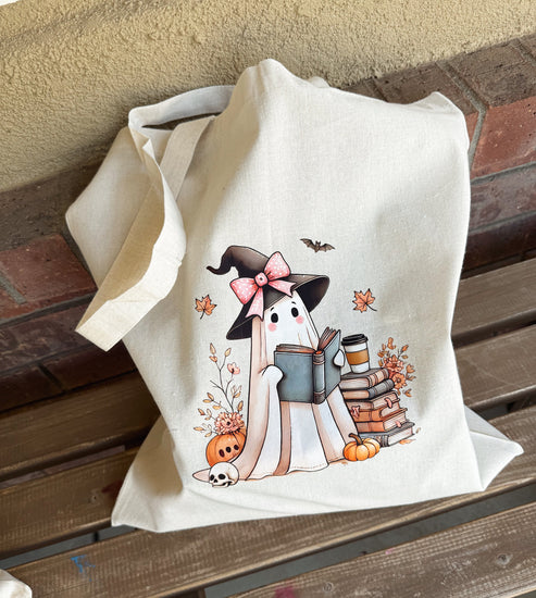 Fall book lover tote featuring whimsical ghost and book design