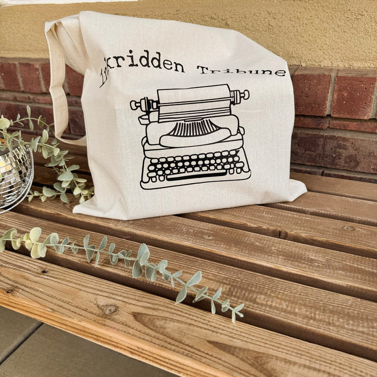Close-up of Inkridden Tribune tote bag design from Divine Rivals