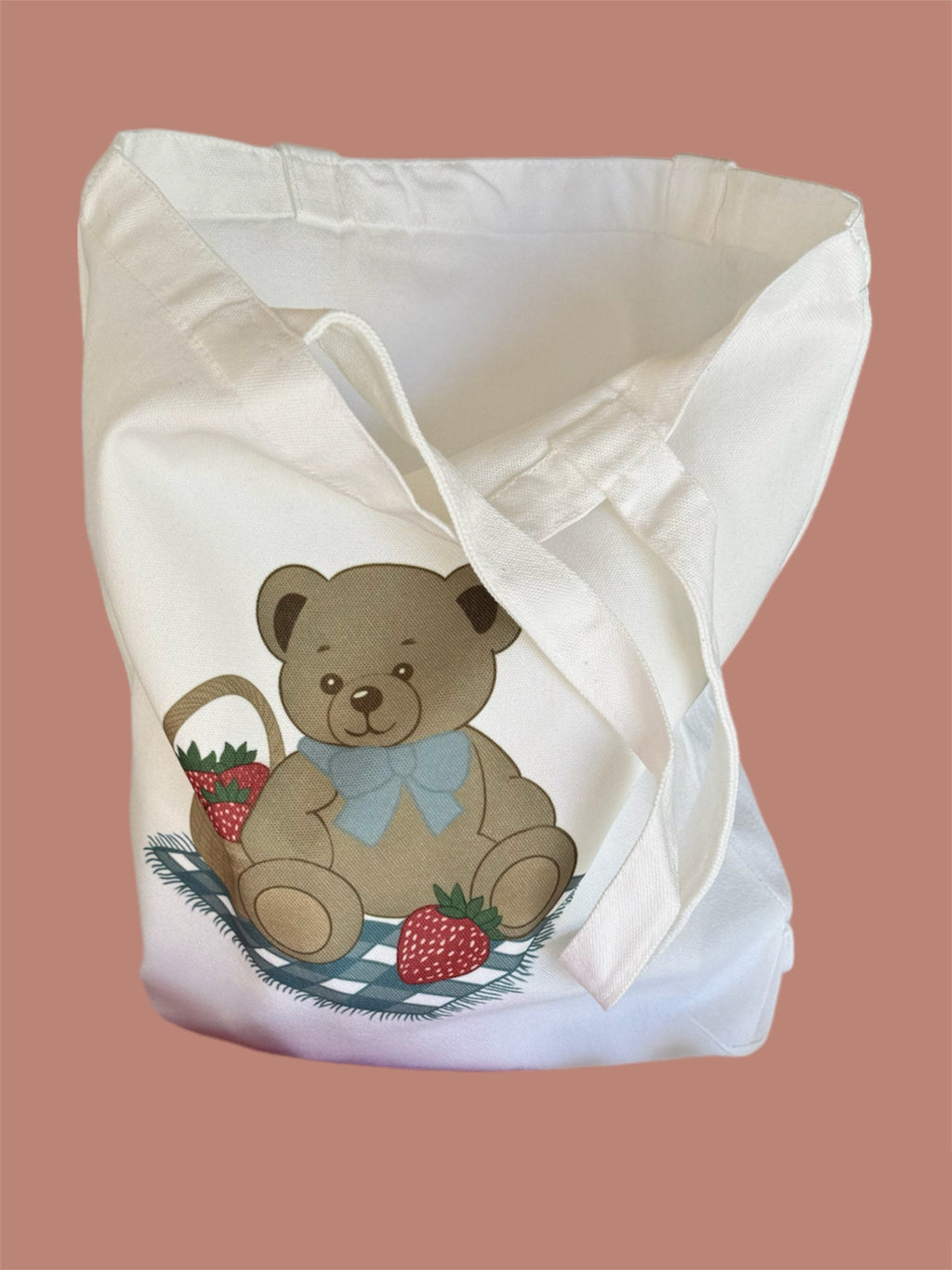 Canvas tote bag with teddy bears, strawberries, and books in coquette pastel colors