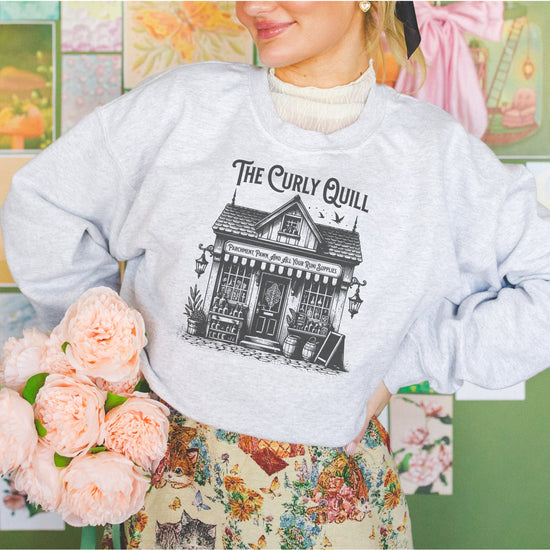 A model wearing a bookish sweatshirt styled for a cozy reading moment.