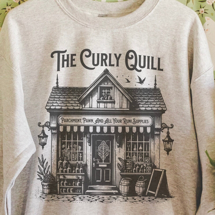 Close-up of soft sweatshirt showing faded graphic and cozy fabric texture.