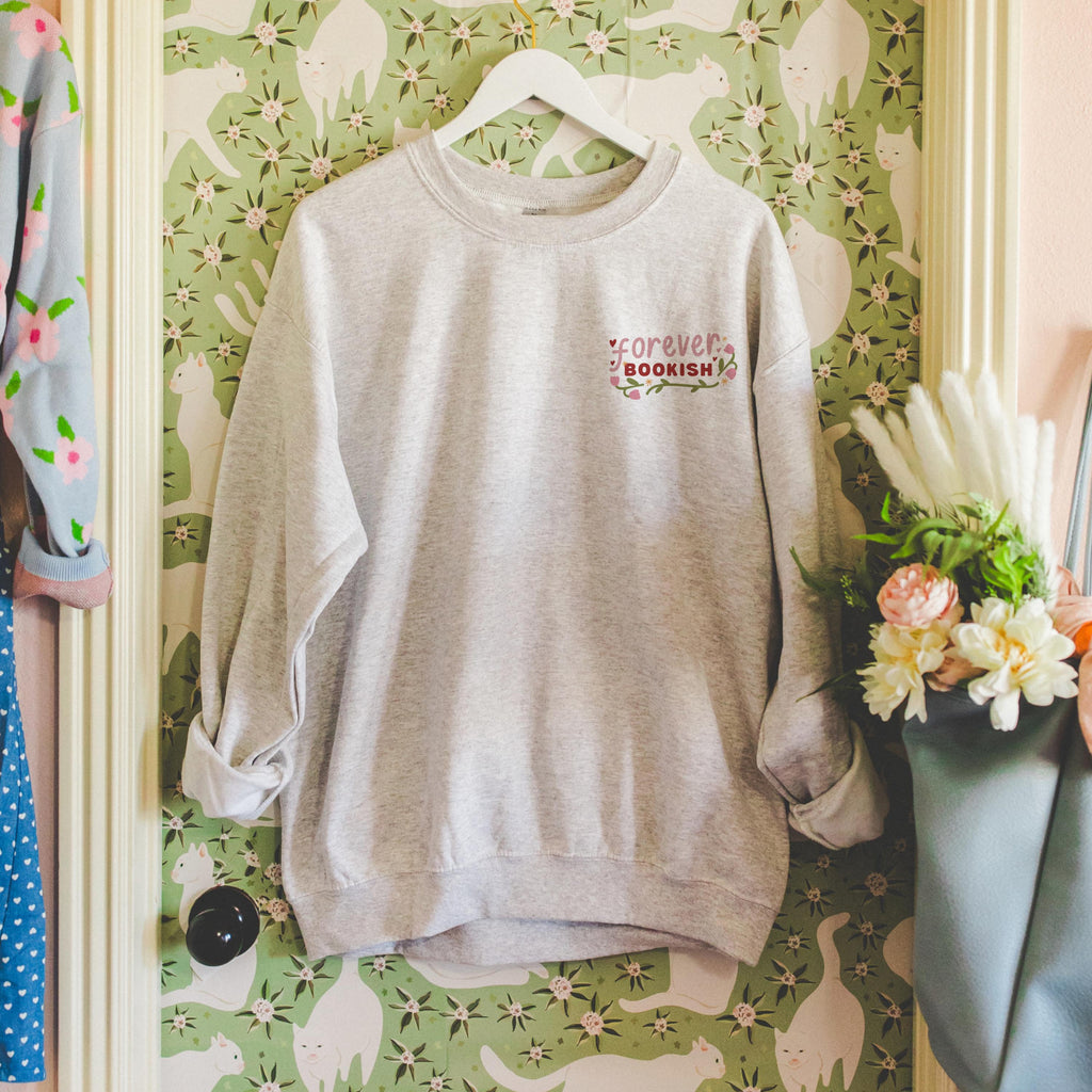 Close-up of Forever Bookish sweatshirt showing cozy soft texture and relaxed fit.