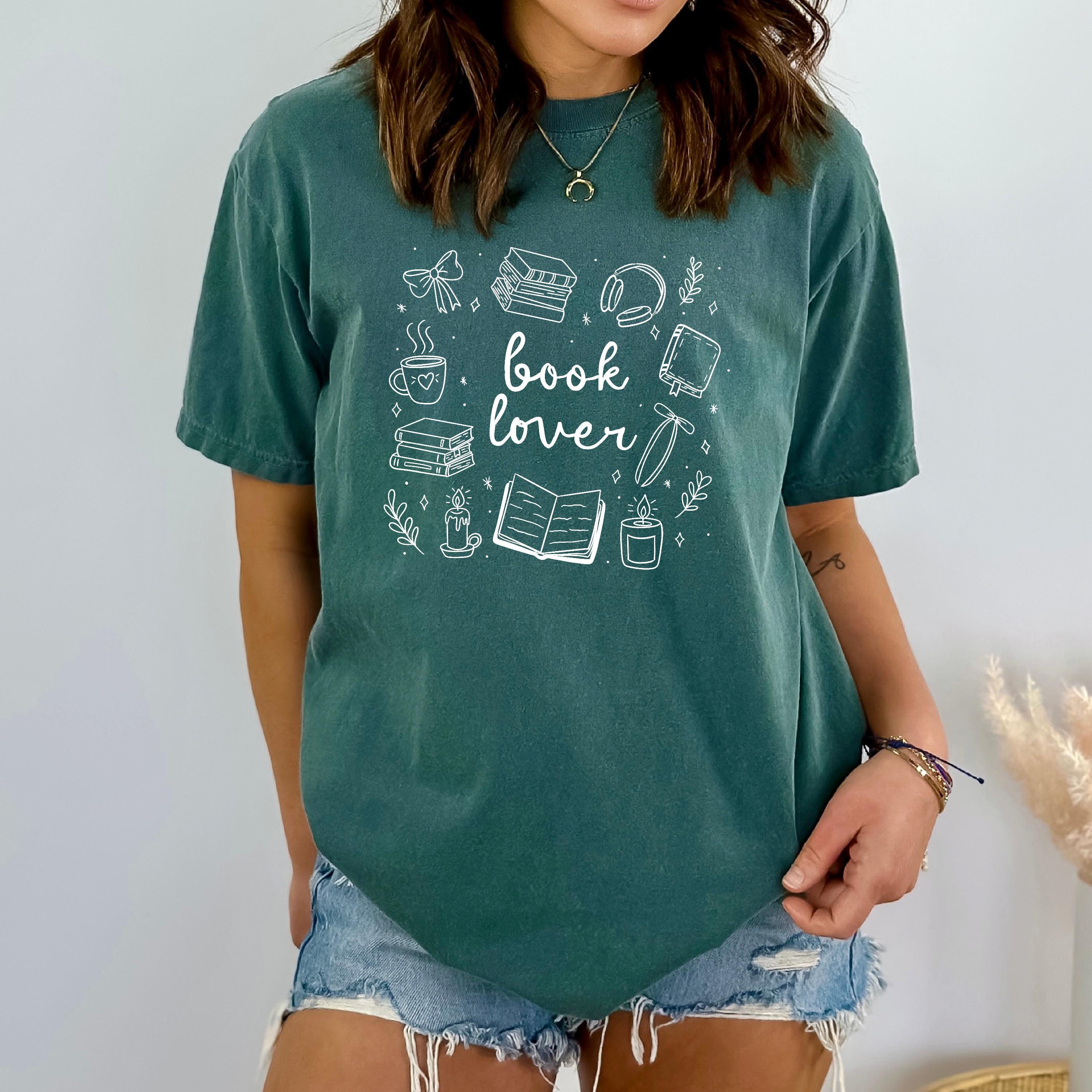 Close-up of soft fabric showing playful “Book Lover” text design.