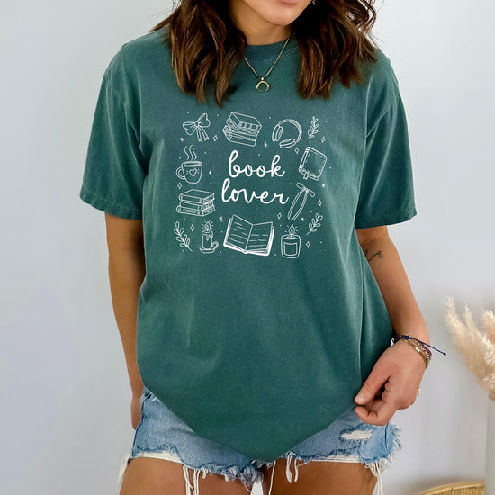 Close-up of soft fabric showing playful “Book Lover” text design.