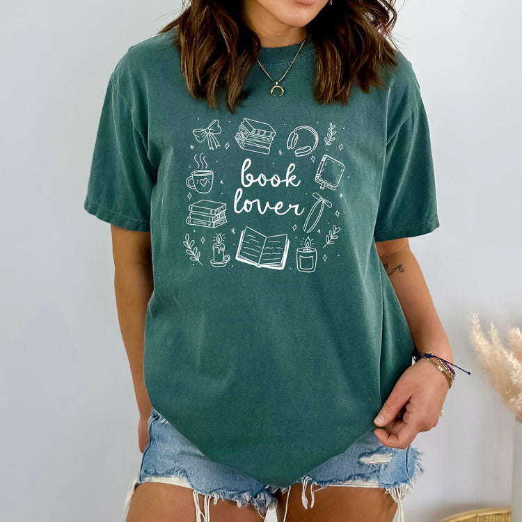 Close-up of soft fabric showing playful “Book Lover” text design.