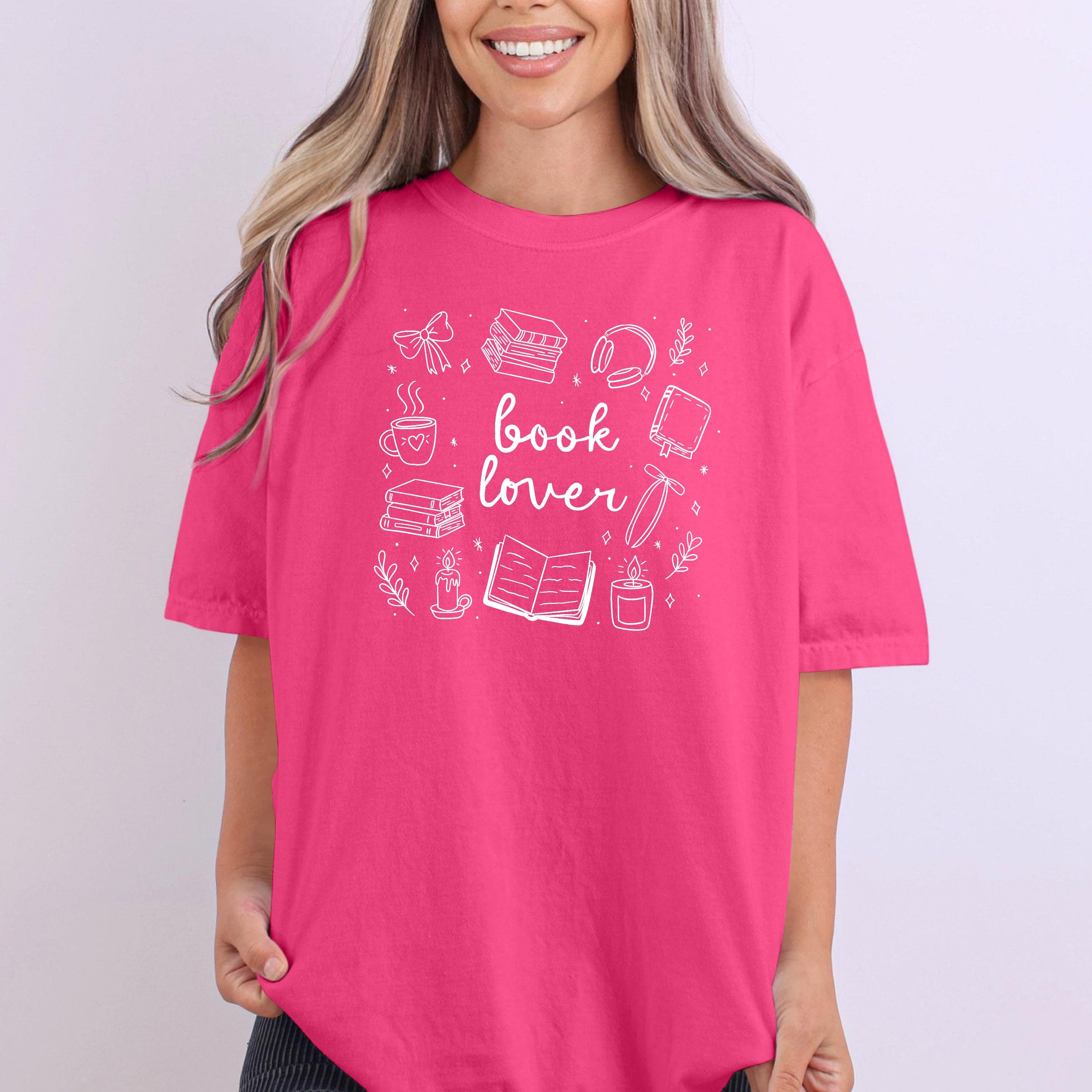 Close-up of soft fabric showing playful “Book Lover” text design.