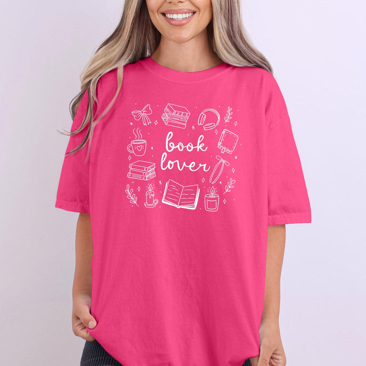 Close-up of soft fabric showing playful “Book Lover” text design.