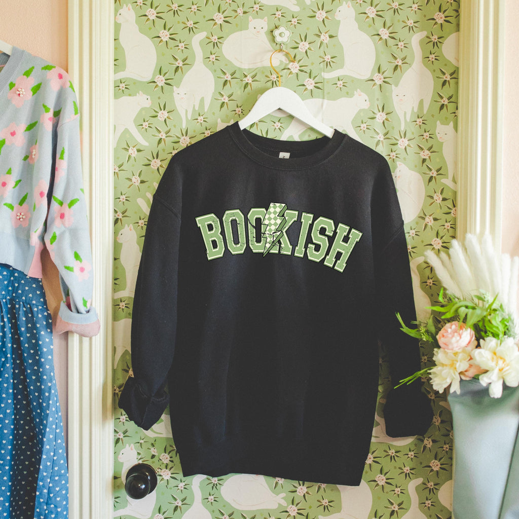 Close-up of Bookish Bolt sweatshirt showing soft fabric texture and printed design.