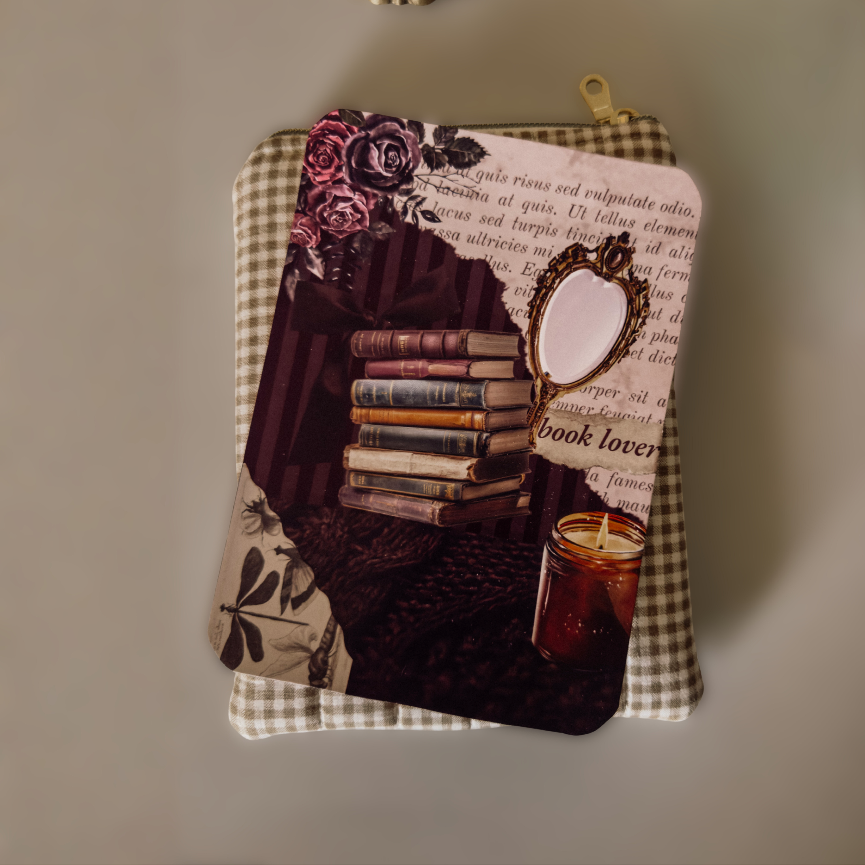Midnight Library Kindle insert featuring vintage plum roses and book stack artwork, tucked into a neutral checkered book sleeve in a cozy, dark academia setting.